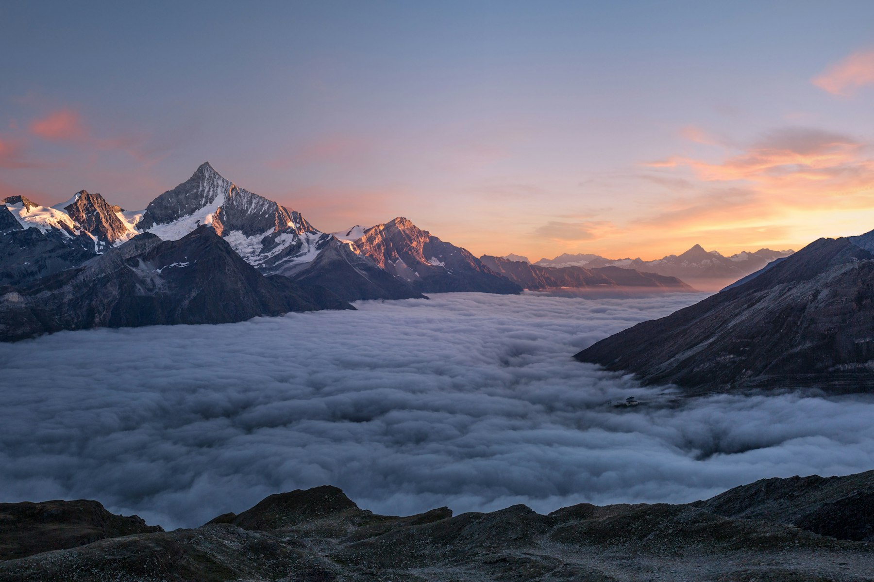 Serene mountain landscape at golden hour with warm sunlight